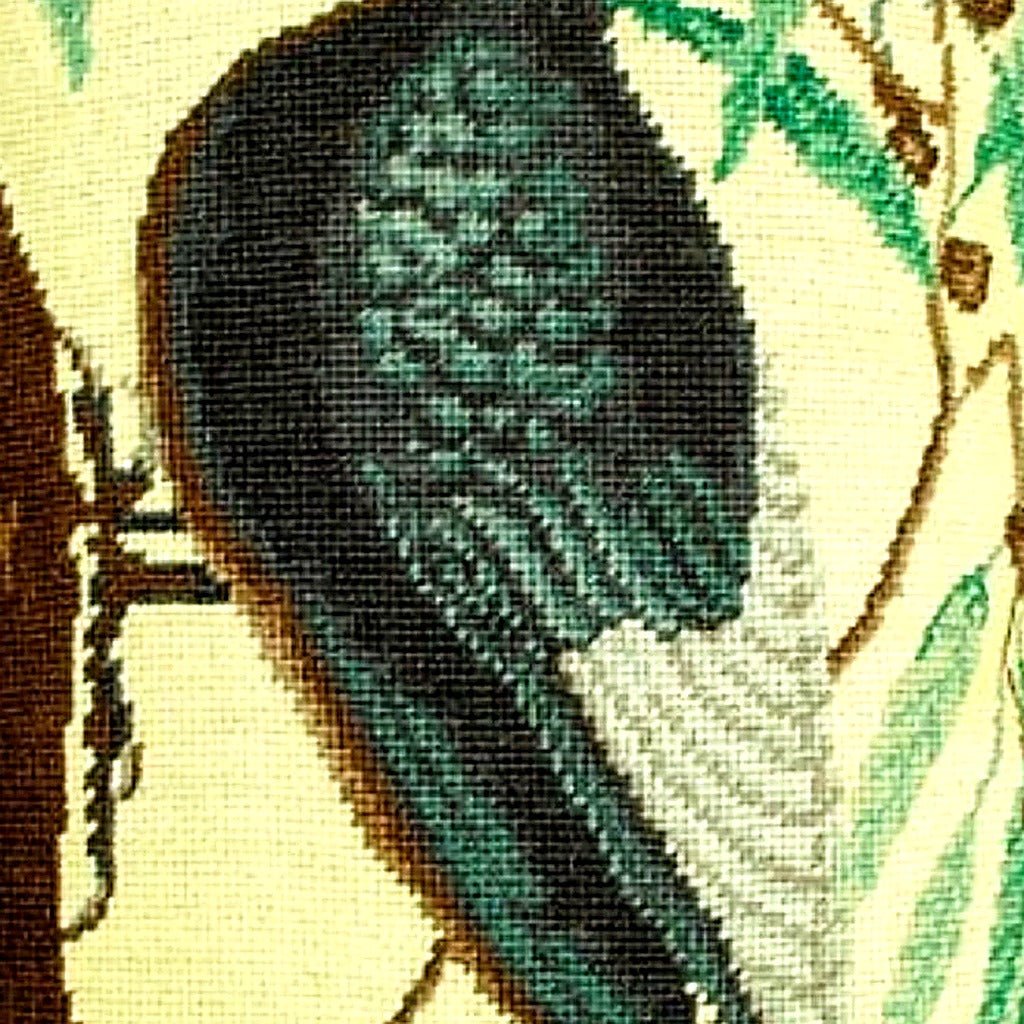 Hand-stitched wool detail of White Bill Woodpecker Audubon needlepoint pillow showing intricate weave pattern and texture
