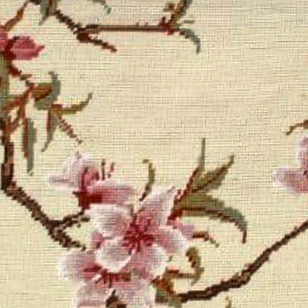 Closeup of White Cherry Blossom Spring needlepoint throw pillow highlighting hand-stitched wool craftsmanship and fabric detail