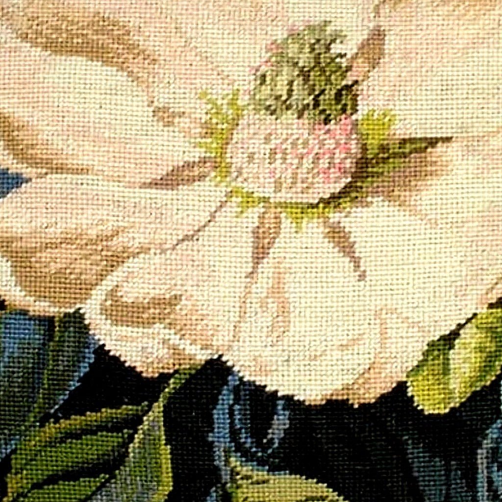 Closeup of White Magnolia needlepoint throw pillow highlighting hand-stitched wool craftsmanship and fabric detail