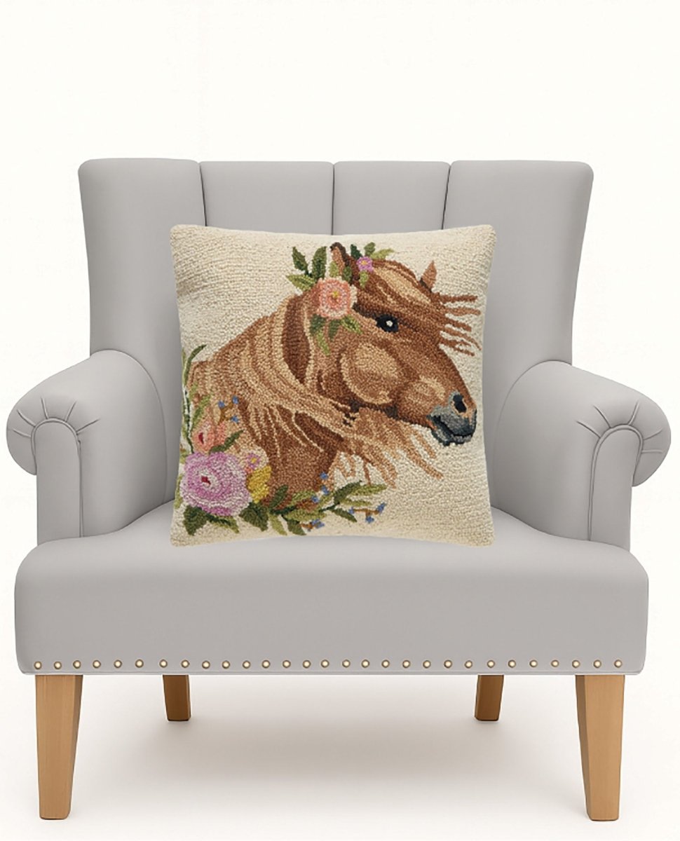 Windswept Horse Hooked Wool Throw Pillow on an armchair, showing the throw pillow at room scale, 18x18 inch