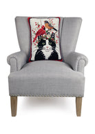 Winter Cat and Birds Hooked Wool Throw Pillow on an armchair, showing the throw pillow at room scale, 14x20 inch