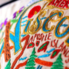 Wisconsin State Dairyland Travel Embroidered Throw Pillow - close-up detail of hand-embroidered needlepoint stitching