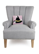 Witch Hat with Stars Hooked Wool Halloween Throw Pillow on an armchair, showing the throw pillow at room scale, 10x10 inch