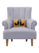 Witch Shoes Hooked Wool Halloween Throw Pillow on an armchair, showing the throw pillow at room scale, 8x12 inch
