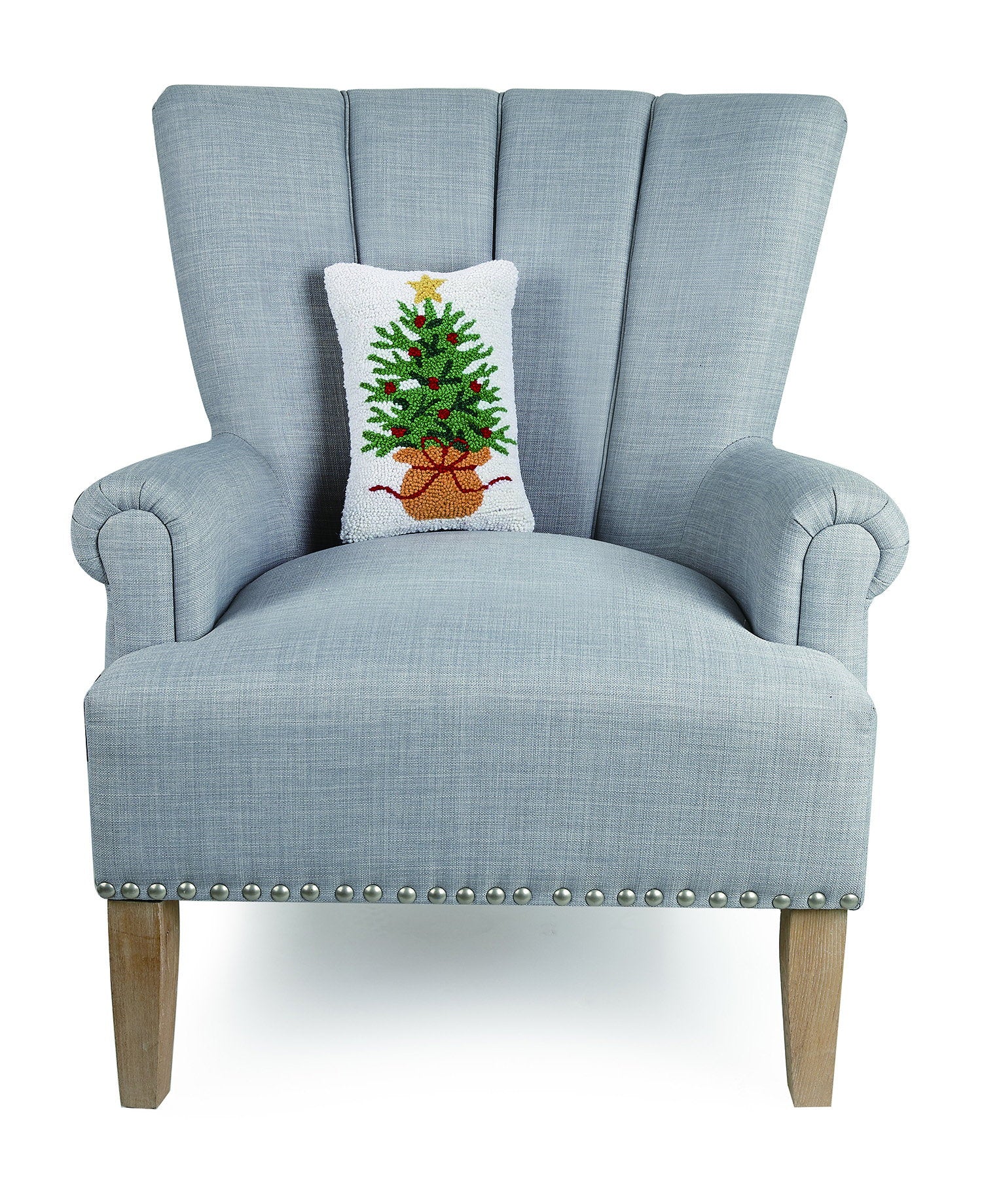 Wrapped Christmas Tree Hooked Wool Throw Pillow on an armchair, showing the throw pillow at room scale, 8x12 inch