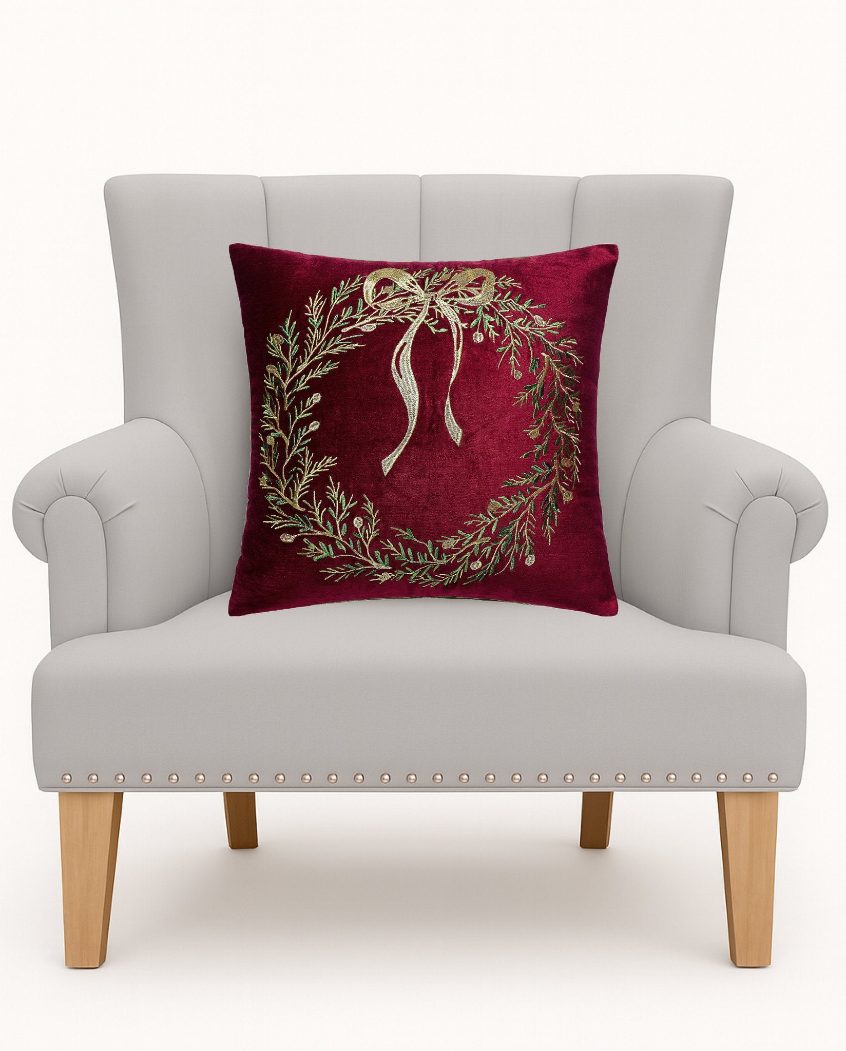 Wreath Velvet Embroidered Christmas Throw Pillow on an armchair, showing the throw pillow at room scale, 16x16 inch