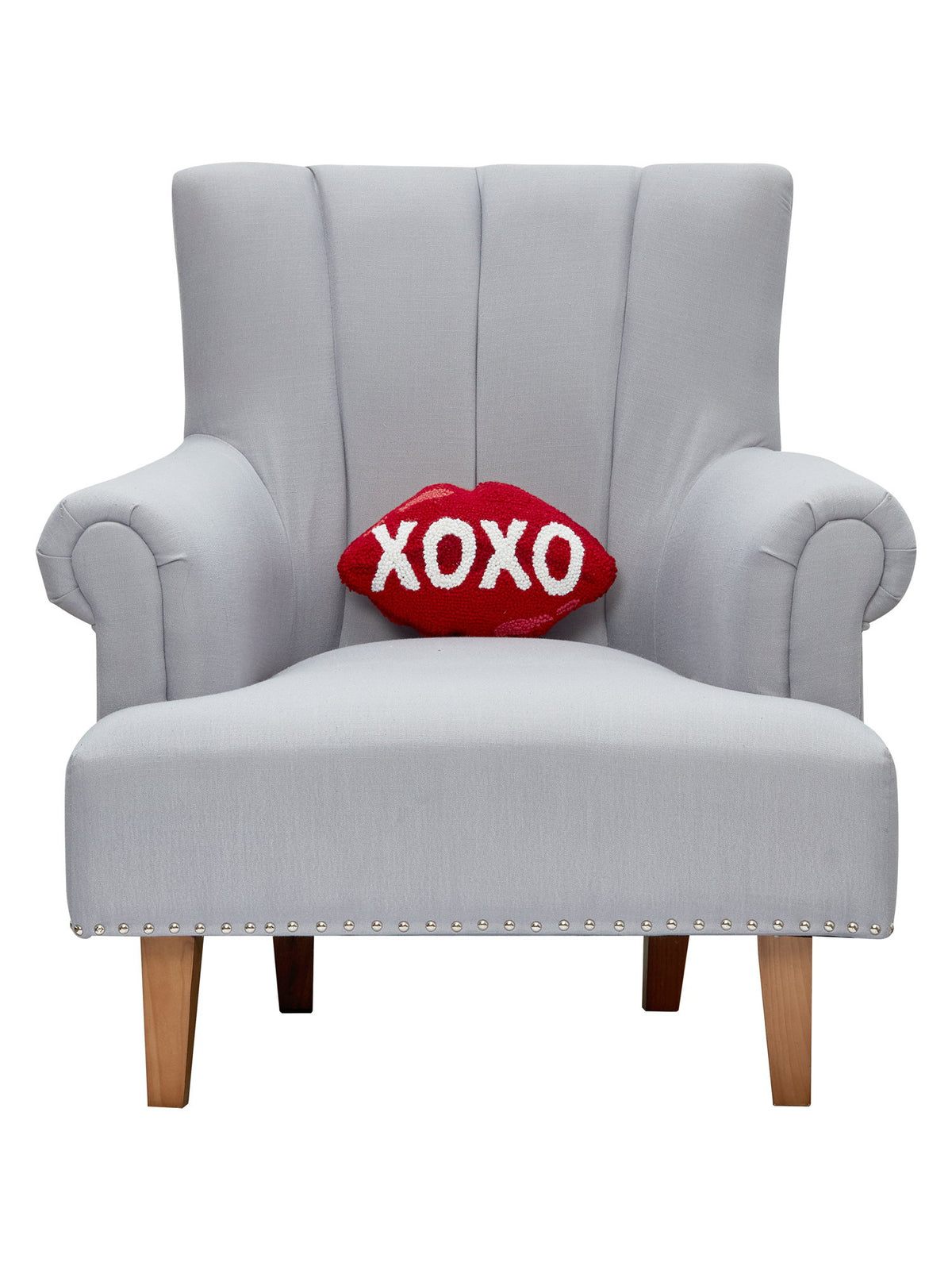 Xoxo Hooked Wool Valentine Throw Pillow on an armchair, showing the throw pillow at room scale, 8x12 inch