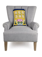 Yellow House Shaped Hooked Wool Christmas Throw Pillow on an armchair, showing the throw pillow at room scale, 12x18 inch