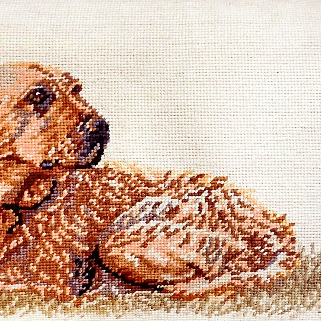 Hand-stitched wool detail of Yellow Lab Rustic Lodge needlepoint pillow showing intricate weave pattern and texture