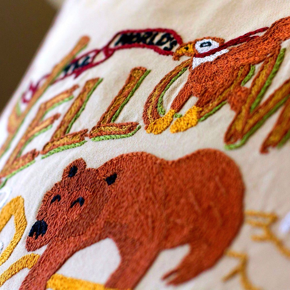 Yellowstone Geysers National Park Embroidered Pillow - close-up detail of hand-embroidered needlepoint stitching