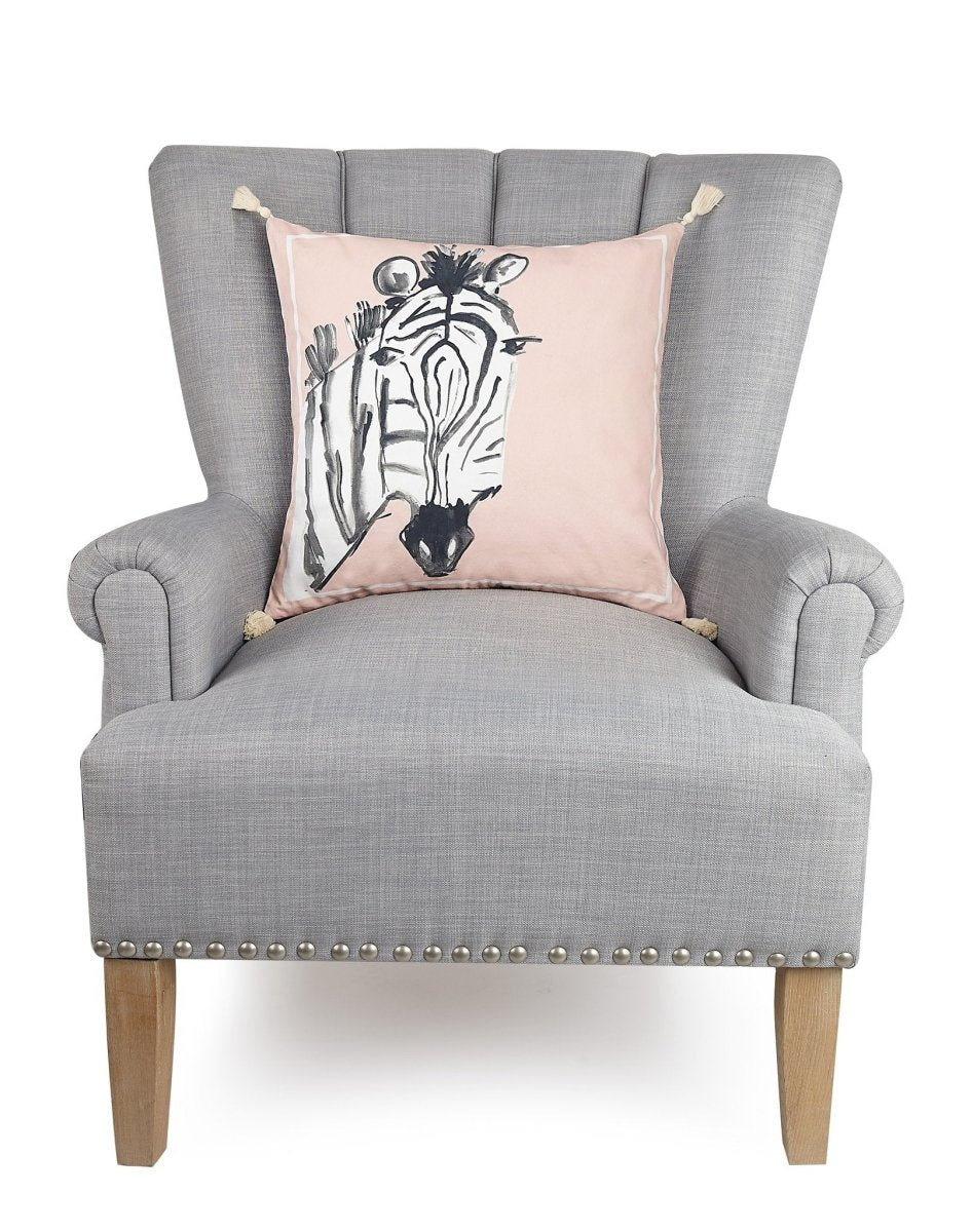 Zebra Embroidered Throw Pillow on an armchair, showing the throw pillow at room scale, 18x18 inch