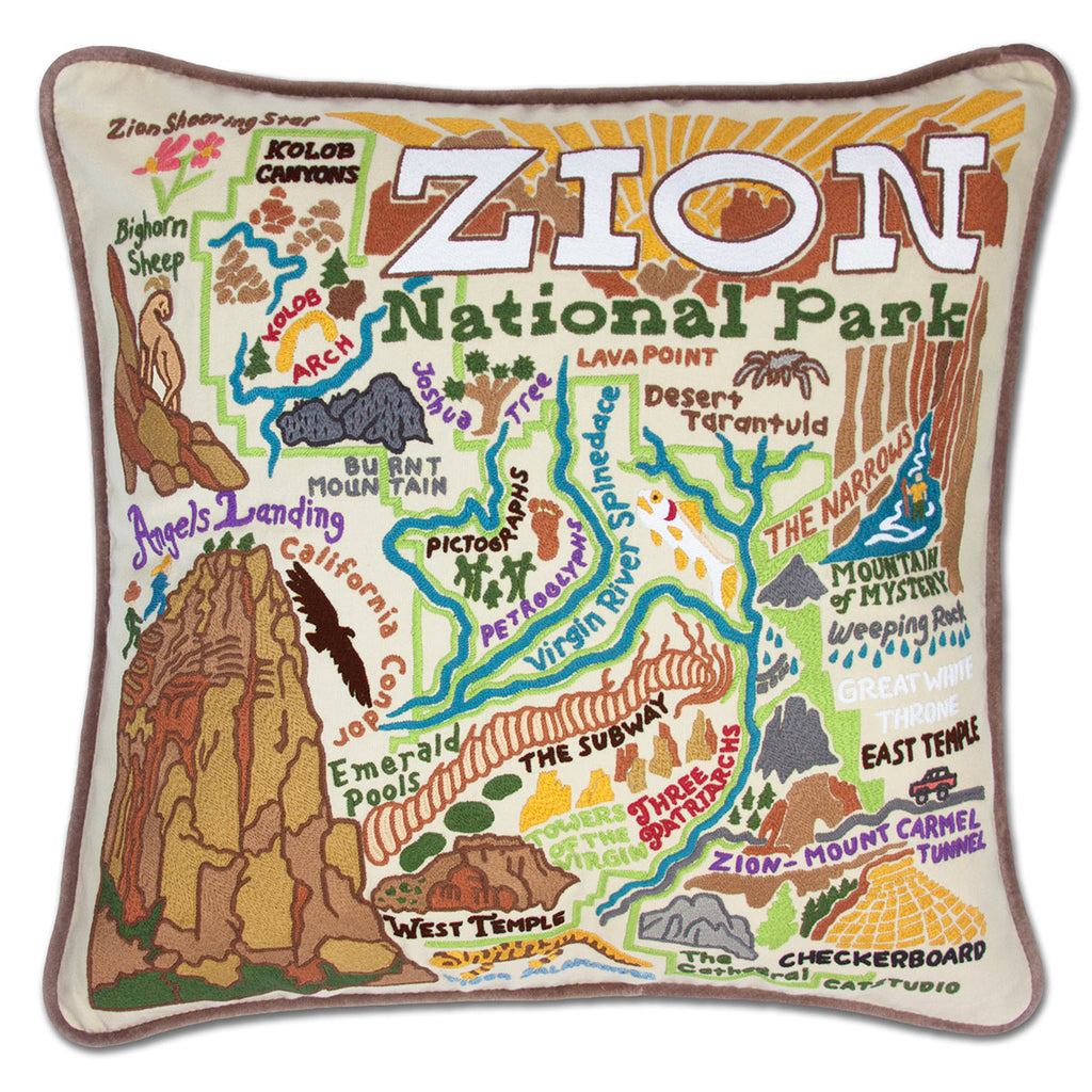 Zion Red Cliffs Adventure Lodge embroidered throw pillow featuring majestic cliffs.
