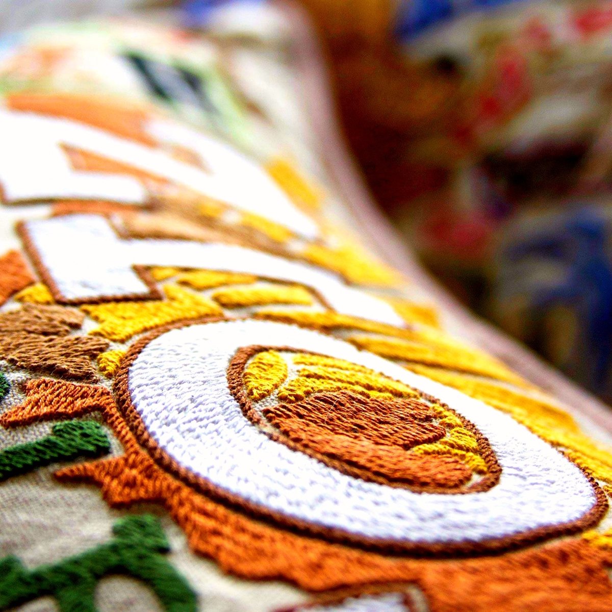 Zion Red Cliffs National Park Embroidered Pillow - close-up detail of hand-embroidered needlepoint stitching